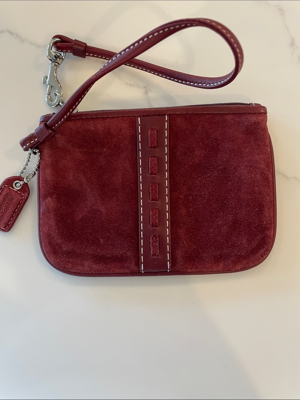NWOT Authentic Coach suede wristlet. Burgundy.